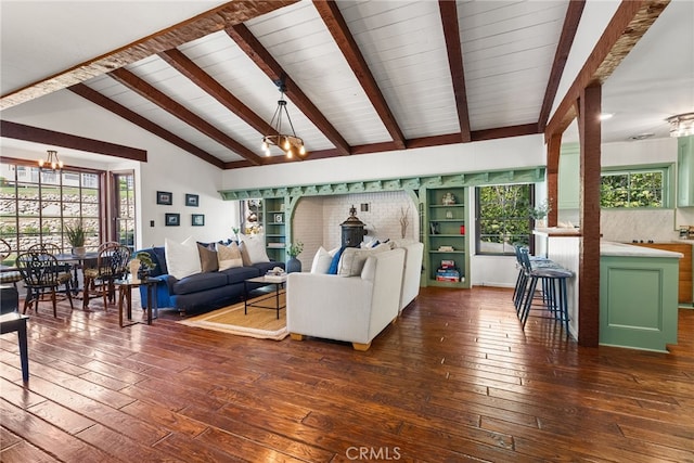 living room featuring vaulted ceiling with beams, dark hardwood / wood-style floors, and a chandelier