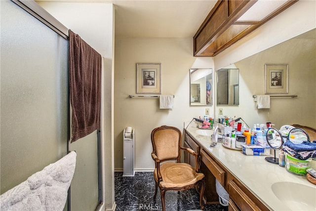 bathroom with vanity and an enclosed shower