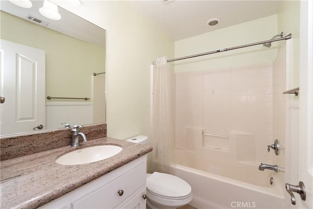 full bathroom featuring vanity, toilet, and shower / bath combo with shower curtain