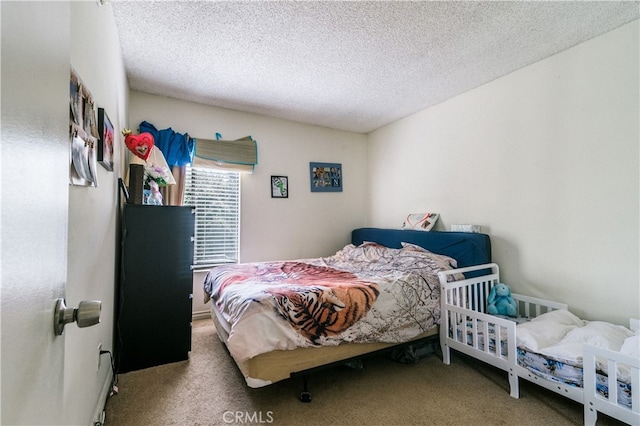 carpeted bedroom featuring a textured ceiling