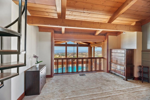 interior space with beam ceiling and wooden ceiling