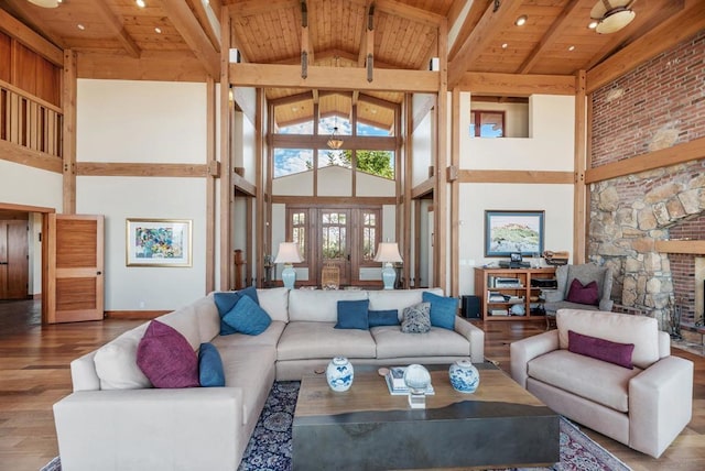 living room with wood-type flooring, wooden ceiling, and high vaulted ceiling