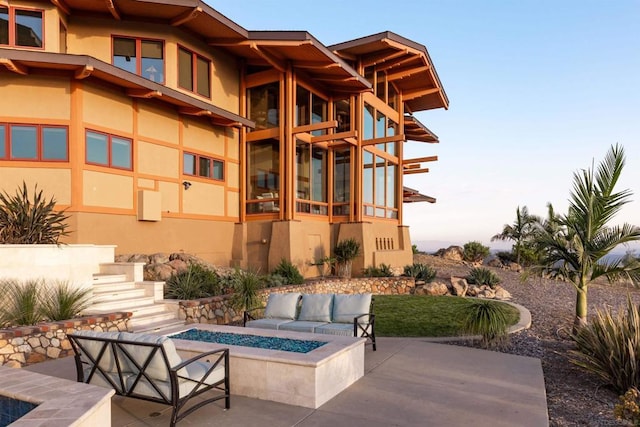 view of patio / terrace with a fire pit