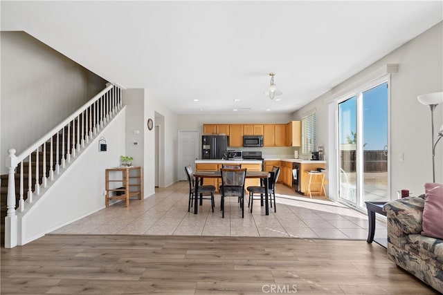 dining area with light hardwood / wood-style flooring