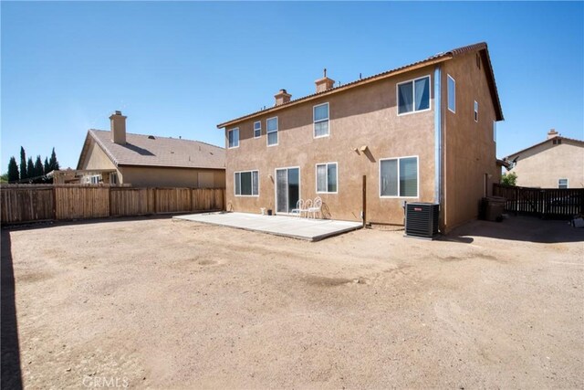 9179 Ravenswood Ave, Hesperia, CA 92344 - rear view of property with cooling unit, a fenced backyard, a patio, and stucco siding