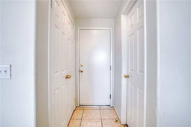 corridor with light tile patterned floors