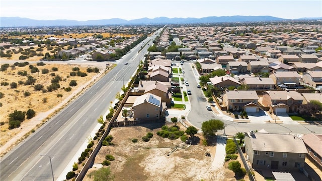 birds eye view of property with a mountain view