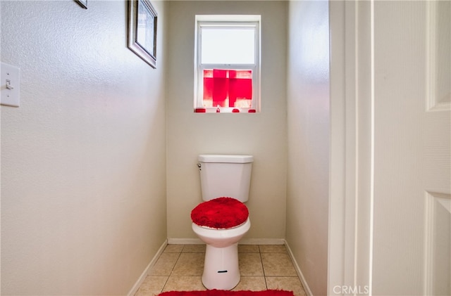 bathroom featuring tile patterned floors and toilet