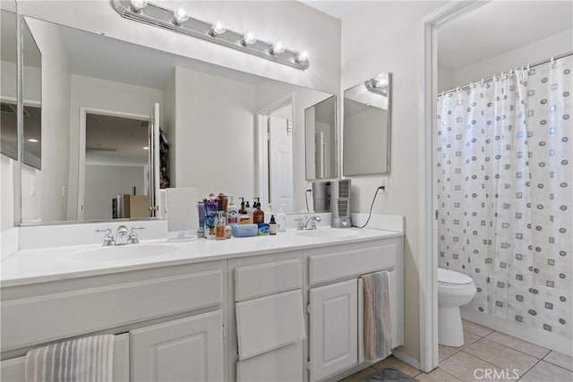 bathroom with vanity, tile patterned flooring, toilet, and a shower with shower curtain