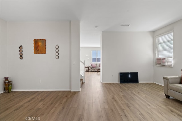 sitting room featuring light hardwood / wood-style floors and a wealth of natural light