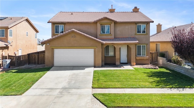 view of front of property featuring a front yard and a garage