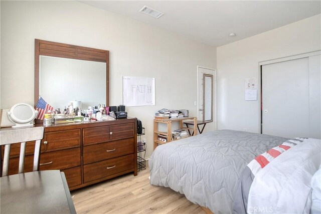 9179 Ravenswood Ave, Hesperia, CA 92344 - bedroom featuring visible vents, light wood-style floors, and a closet