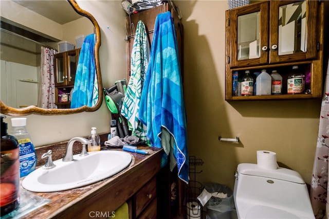 bathroom featuring vanity and toilet