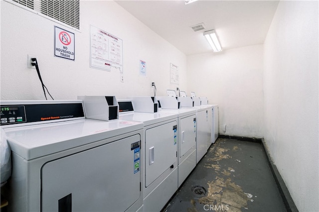 washroom featuring washing machine and dryer