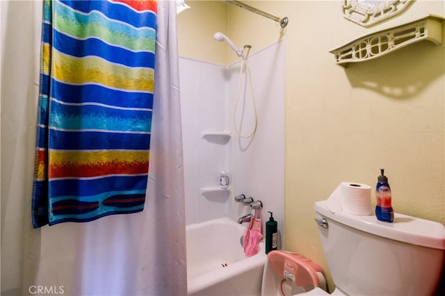 bathroom with shower / tub combo and toilet