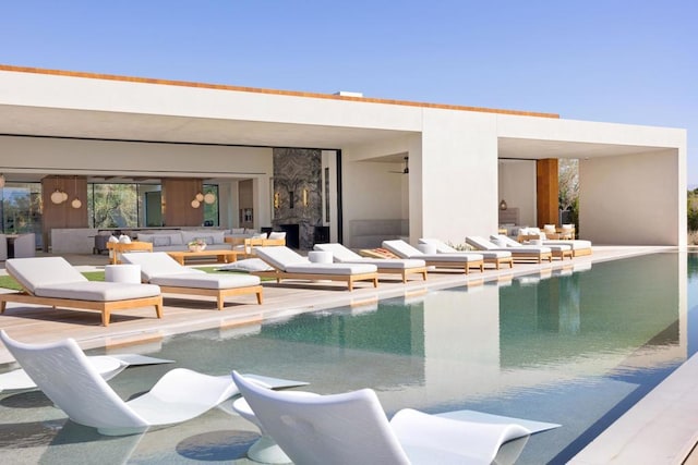 view of swimming pool with an outdoor living space and a patio area