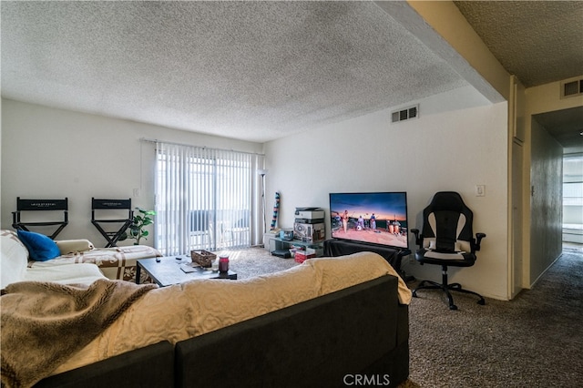 carpeted living room featuring a textured ceiling