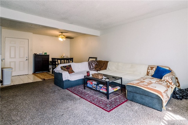 carpeted living room with a textured ceiling and ceiling fan