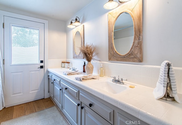 bathroom featuring vanity and hardwood / wood-style floors