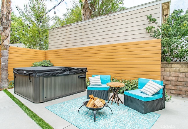 view of patio with a hot tub