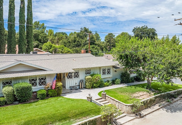 ranch-style home with a front yard