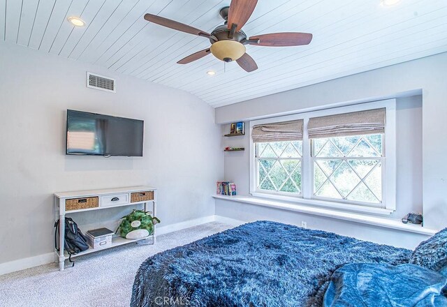 bedroom featuring wood ceiling, carpet, and ceiling fan