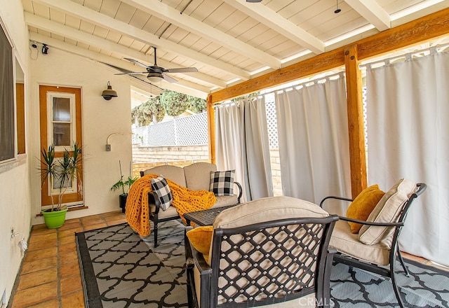 sunroom / solarium featuring ceiling fan, vaulted ceiling with beams, and wood ceiling