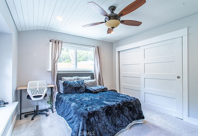 bedroom featuring wooden ceiling, vaulted ceiling, light carpet, and ceiling fan