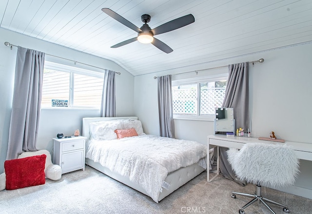 bedroom with wooden ceiling, vaulted ceiling, light carpet, and ceiling fan