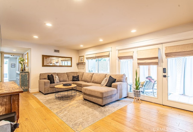 living room with light hardwood / wood-style flooring