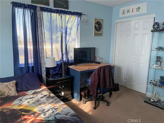 carpeted bedroom with a closet