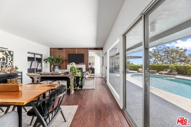 dining space with dark hardwood / wood-style floors