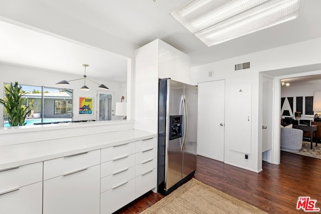 walk in closet featuring dark hardwood / wood-style floors