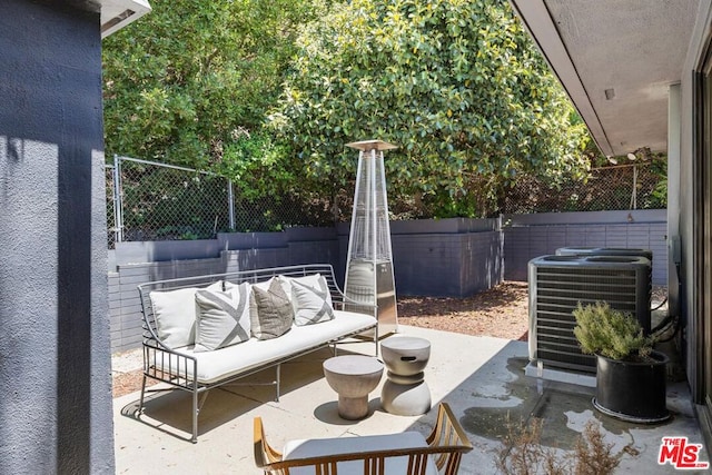 view of patio / terrace featuring an outdoor living space and central air condition unit