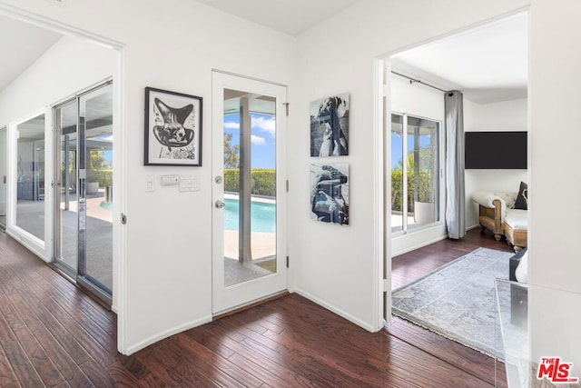 entryway with french doors and dark hardwood / wood-style floors