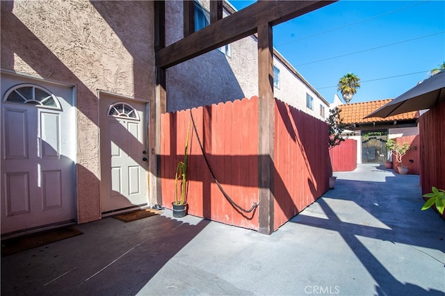 property entrance featuring a patio