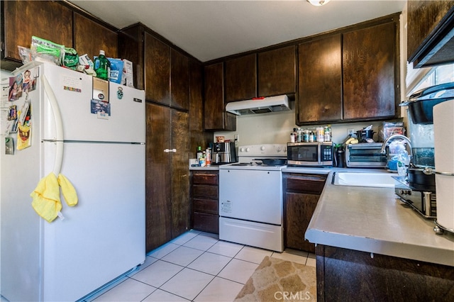 kitchen featuring white appliances, light tile patterned flooring, dark brown cabinets, and sink