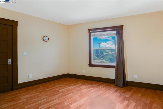 empty room featuring hardwood / wood-style floors