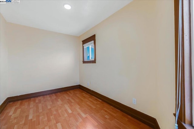 spare room with hardwood / wood-style flooring