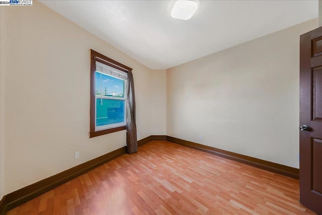 spare room with light hardwood / wood-style floors