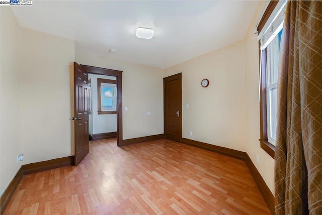 empty room featuring wood-type flooring