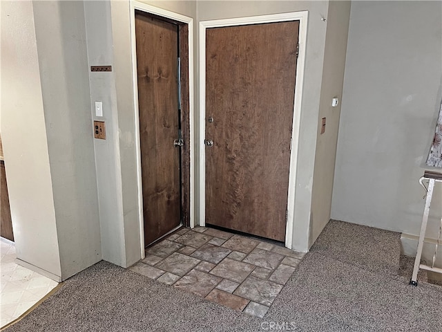 entrance foyer featuring light carpet