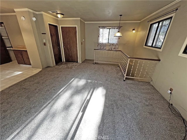 interior space featuring ornamental molding and light carpet