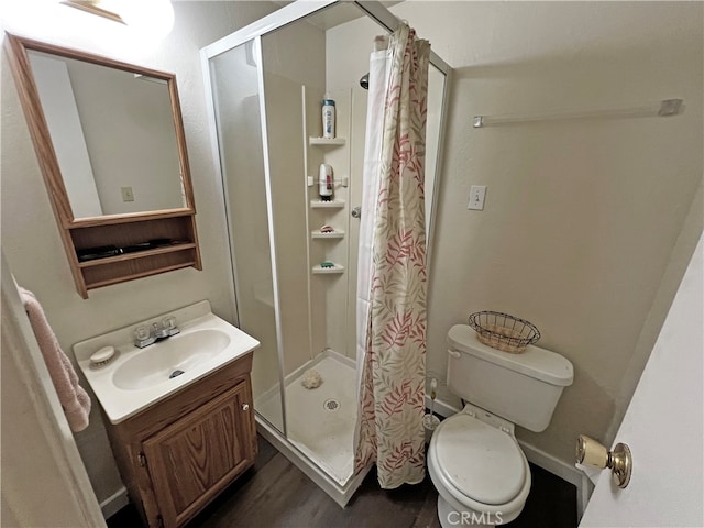 bathroom with vanity, toilet, a shower with shower curtain, and hardwood / wood-style flooring