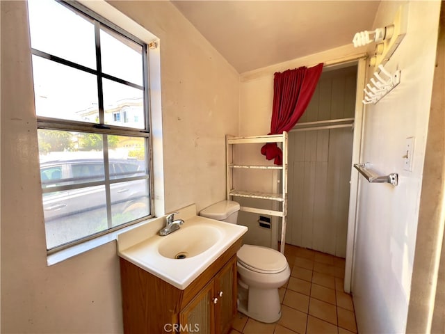 bathroom featuring vanity, toilet, and tile patterned floors