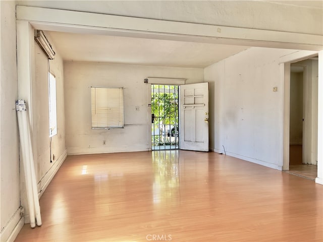 spare room featuring light hardwood / wood-style floors