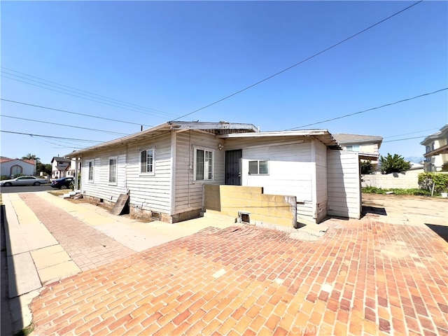 rear view of house with a patio