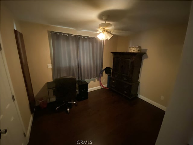 office space featuring dark hardwood / wood-style flooring and ceiling fan