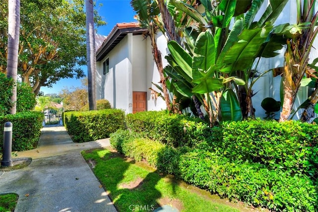 view of side of property with stucco siding