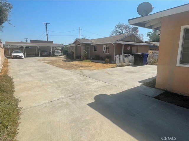 exterior space with a carport